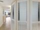 Hallway showing the foyer and a storage closet with white, louvered doors at 6804 Gulf Dr # 6804, Holmes Beach, FL 34217