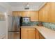 Close up of kitchen with stainless steel appliances and beautiful tile backsplash at 6804 Gulf Dr # 6804, Holmes Beach, FL 34217