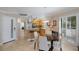 Open-concept kitchen with modern appliances, breakfast bar, and an adjacent dining area at 6804 Gulf Dr # 6804, Holmes Beach, FL 34217