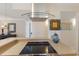 Close-up of the stovetop and ventilation of the charming kitchen at 6804 Gulf Dr # 6804, Holmes Beach, FL 34217