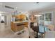 Cozy kitchen with stainless appliances, wooden cabinetry, breakfast bar and dinette at 6804 Gulf Dr # 6804, Holmes Beach, FL 34217