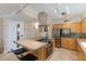 Spacious kitchen equipped with stainless steel appliances and a convenient breakfast bar at 6804 Gulf Dr # 6804, Holmes Beach, FL 34217