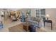 Well-lit living room with modern furnishings, tile floors, and seamless access to the kitchen at 6804 Gulf Dr # 6804, Holmes Beach, FL 34217