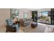 Comfortable living room with stylish furniture, a cozy rug, and sliding glass doors leading to a balcony at 6804 Gulf Dr # 6804, Holmes Beach, FL 34217