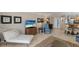 Cozy living room featuring a comfortable chaise lounge, stylish decor, and a seamless flow to the kitchen at 6804 Gulf Dr # 6804, Holmes Beach, FL 34217