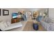 Bright living room with tile floors, comfy seating, and beachy decor at 6804 Gulf Dr # 6804, Holmes Beach, FL 34217