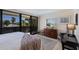 Comfortable main bedroom with a dresser and sliding doors leading to outdoor views at 6804 Gulf Dr # 6804, Holmes Beach, FL 34217