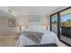 Cozy main bedroom with a plush bed and sliding glass doors to the outside at 6804 Gulf Dr # 6804, Holmes Beach, FL 34217
