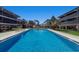 Enjoy the community pool with lounge chairs in an attractive setting perfect for soaking up the sun at 6804 Gulf Dr # 6804, Holmes Beach, FL 34217