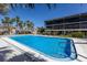 This community pool is surrounded by tropical palms and lush landscaping in a tranquil setting at 6804 Gulf Dr # 6804, Holmes Beach, FL 34217