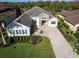Stunning aerial view of home featuring landscaped yard and paver driveway at 7095 Tamworth Pkwy, Sarasota, FL 34241