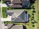 Overhead view highlighting the home's tile roof, screened pool, and beautifully landscaped backyard at 7095 Tamworth Pkwy, Sarasota, FL 34241