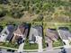 Neighborhood aerial showcasing backyard pools, lush trees, and well-maintained lawns in a desirable area at 7095 Tamworth Pkwy, Sarasota, FL 34241