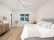 Bright main bedroom featuring light-colored floors, neutral paint and a window for natural light at 7095 Tamworth Pkwy, Sarasota, FL 34241