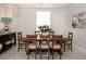 Dining room with large table and chairs, and ample natural light at 7095 Tamworth Pkwy, Sarasota, FL 34241