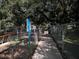 Entrance to the large dog area, featuring a fenced perimeter and information signage at 7095 Tamworth Pkwy, Sarasota, FL 34241