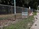 Entrance sign to Lakeview Dog Park, surrounded by fencing and trees at 7095 Tamworth Pkwy, Sarasota, FL 34241