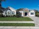 Charming home featuring manicured landscaping, stone accents, and a welcoming entryway at 7095 Tamworth Pkwy, Sarasota, FL 34241