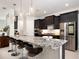 Stylish kitchen featuring a large island, stainless steel appliances, and modern finishes at 7095 Tamworth Pkwy, Sarasota, FL 34241