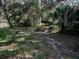 Scenic park area featuring a picnic table next to a natural pond and surrounding greenery at 7095 Tamworth Pkwy, Sarasota, FL 34241