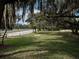 Scenic park view with Spanish moss-draped trees and walking path at 7095 Tamworth Pkwy, Sarasota, FL 34241