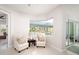 Cozy sitting room with comfortable chairs and views of the pool area at 7095 Tamworth Pkwy, Sarasota, FL 34241