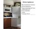 This kitchen has a convection microwave, full size washer and dryer and side by side refrigerator at 722 S Blvd Of The Presidents # 201, Sarasota, FL 34236