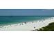 Beautiful sandy beach with turquoise water, perfect for swimming, sunbathing, and relaxation at 722 S Blvd Of The Presidents # 201, Sarasota, FL 34236