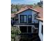 Charming two-story home with a cozy balcony, offering a glimpse of comfortable living at 722 S Blvd Of The Presidents # 201, Sarasota, FL 34236