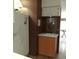 Kitchen area with a refrigerator, sink, and overhead cabinets for ample storage at 722 S Blvd Of The Presidents # 201, Sarasota, FL 34236