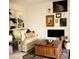 Cozy living room with decorative art, coffee table and shelving at 722 S Blvd Of The Presidents # 201, Sarasota, FL 34236