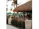 Outdoor bar with tropical ambiance, offering a relaxing space for social gatherings and entertainment at 722 S Blvd Of The Presidents # 201, Sarasota, FL 34236