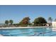 Enjoy a refreshing swim in the community pool with ample seating and lush landscaping at 722 S Blvd Of The Presidents # 201, Sarasota, FL 34236
