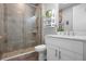 Bathroom with tile shower, updated vanity, and modern fixtures at 7730 34Th W Ave # 103, Bradenton, FL 34209
