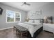 Serene bedroom features plantation shutters, a plush bed, and decorative bench seating at 7730 34Th W Ave # 103, Bradenton, FL 34209