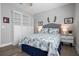 Comfortable bedroom with built-in storage and coastal-themed decor at 7730 34Th W Ave # 103, Bradenton, FL 34209