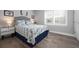 Cozy bedroom featuring coastal decor, plantation shutters, and tile flooring at 7730 34Th W Ave # 103, Bradenton, FL 34209