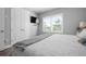 Bright bedroom with plantation shutters, a TV, and neutral decor at 7730 34Th W Ave # 103, Bradenton, FL 34209