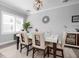 This dining room features a modern light fixture and seating for six at 7730 34Th W Ave # 103, Bradenton, FL 34209