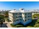 Exterior corner view of condo building with multiple balconies at 7730 34Th W Ave # 103, Bradenton, FL 34209