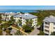 Exterior aerial showcasing lush landscaping surrounding a waterfront condo building at 7730 34Th W Ave # 103, Bradenton, FL 34209