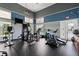 The property features a gym with various exercise machines, a TV, and windows offering views of the exterior at 7730 34Th W Ave # 103, Bradenton, FL 34209
