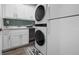 Well-equipped laundry room features washer and dryer, ample storage, and modern conveniences at 7730 34Th W Ave # 103, Bradenton, FL 34209