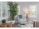 Sitting area provides a cozy retreat with a comfortable chair, ample natural light, and stylish accents at 7730 34Th W Ave # 103, Bradenton, FL 34209