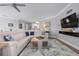 Spacious open-concept living area seamlessly connects the kitchen with its white cabinets and the main living area at 7730 34Th W Ave # 103, Bradenton, FL 34209