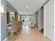 Bright lobby area features tile floors, a seating area, a wet bar, and entry doors to the exterior of the property at 7730 34Th W Ave # 103, Bradenton, FL 34209