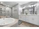 This main bathroom features a soaking tub and dual vanities at 7730 34Th W Ave # 103, Bradenton, FL 34209