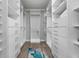 The custom, walk-in closet maximizes storage space with rods, shelves, and drawers at 7730 34Th W Ave # 103, Bradenton, FL 34209
