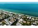 Breathtaking aerial view of coastal neighborhood with serene canals and beach access to the ocean waters at 807 S Bay Blvd, Anna Maria, FL 34216