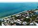 Gorgeous aerial view of the waterfront homes lining a canal leading to the Gulf of Mexico at 807 S Bay Blvd, Anna Maria, FL 34216